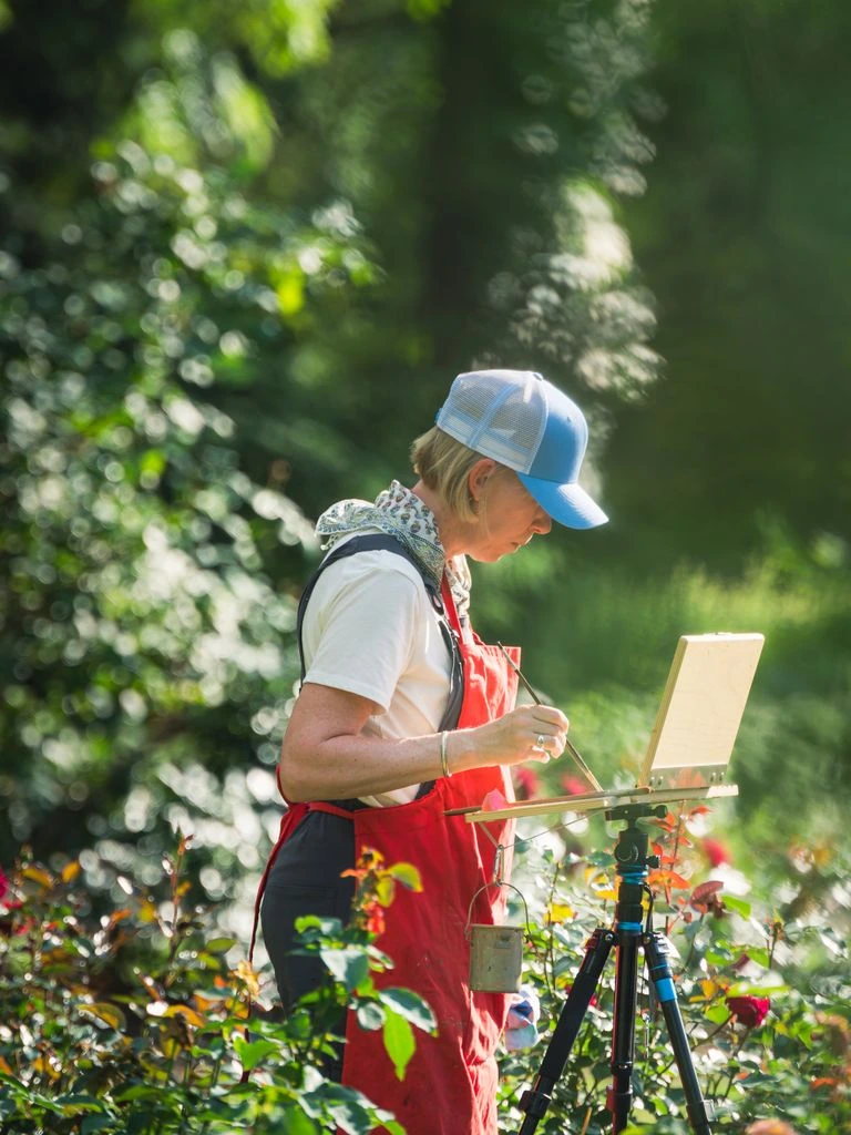 Alex Dzigurski painting on location in the Eastern Sierra with a French easel and open paint box.